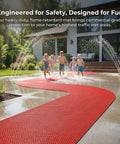 Game Changer Non Slip Drainage Flooring Rolls Custom Trim Down To Fit Pool Bathroom Garage Spa Warehouse Durable Water Resilient PVC Mats Thick Anti Fatigue Heavy Duty Commercial Grade Smooth Surface with kids running on it.