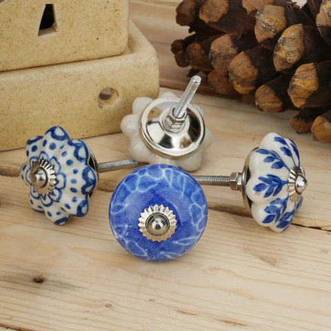 Colorful Blue Ceramic Cabinet Knobs Set Of 25 For Kitchen Cabinets, Bathrooms, Dressers, Cupboards And Drawers, Handmade Pottery Decorative Hardware To Elevate Your Furniture Game And Give It A Fresh Look displayed on wooden surface.