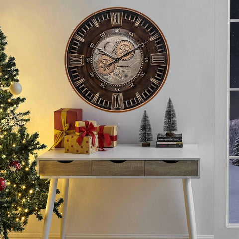 Killer Twenty Four Inch Oversized Wall Clock Featuring Real Moving Gears Heavily Distressed Antique Gold Dial Bold Roman Numerals above a desk with gifts.