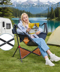 Woman sitting in Hammock Camping Chair With Adjustable Backrest And Pillow Cup Holder, Heavy Duty 350 Lbs Oversized Swinging Chair outdoors