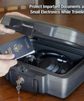 Image of Fireproof And Waterproof Portable Safe Lock Box With Key Lock And Carrying Handle For Money Passport And Valuables Exterior Size 14.3 In W 13 In D 6.1 In H Travel Ready, showing an open safe with a passport and headphones inside.