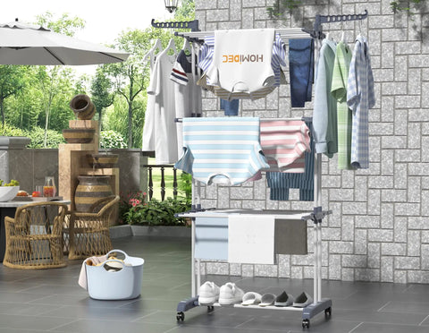 Top Shelf Oversized Four Tier Clothes Drying Rack With A Built Tough Foldable Frame Plus Side Wings For Hanging Laundry Towels Shoes And Quilts Roomy Air Drying Setup with clothes drying outdoors.