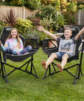 Two kids enjoying Ultra Comfy Portable Hammock Camping Chair With Adjustable Backrest, Padded Armrests And Headrest in backyard