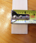 Close-up of American-Made Basswood Paint Stir Sticks 21 Inch Bulk 250 Count with measuring tape showing width