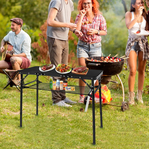 Foldable Camping Table With Storage Net Aluminum Portable Table With Three Height Settings Up To 27.3 Inches at a picnic
