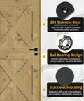 JAVOUKA black metal door hinge on a wooden barn-style door (front view)