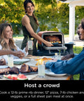 Person using Woodfire Outdoor Pizza Oven 8 In 1 Portable Electric Roaster Heats Up To 700 Degrees Fahrenheit on patio
