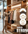 Premium Wooden Coat Hangers Set Of 30 With Slim Profile Built To Last 360 Degree Rotating Hook Contoured Shoulders For Jackets And Suits Natural Finish Space Saving Closet Upgrade displayed in stylish closet.