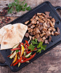 Two Burner Cast Iron Griddle, Reversible Grill Pan, 13 By 8.5 Inches, Ready To Use With Kosher Certified Non GMO Flaxseed Oil Seasoning, No PTFE Or PFOA, Built Tough And Heat Retentive, with cooked meats and vegetables.