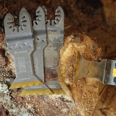 Five Piece Universal Oscillating Multitool Blade Set with titanium coated M42 HSS bi metal blades on wood surface
