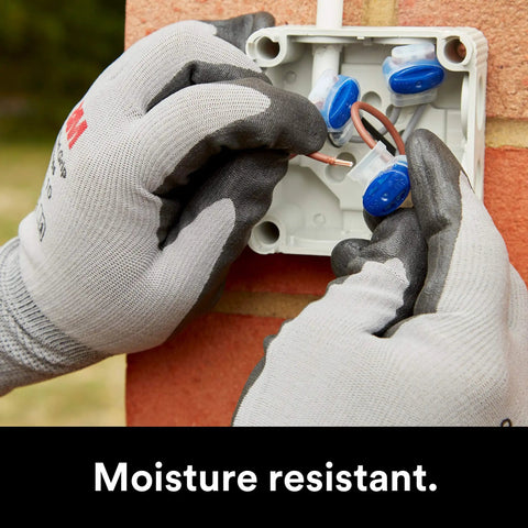 Hands installing Blue Insulation Displacement Connector For 2 Or 3 Wires Pigtail Self Stripping And Moisture Resistant 22 To 14 AWG