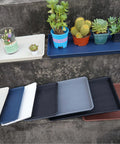 Heavy Duty Plant Drainage Saucers 2 Pack Rectangular Seed Starter Trays 11x9 Inch Plastic Drip Trays with various pots and cacti.