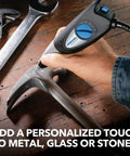 120-Volt Engraver Rotary Tool With Stencil Kit for DIY personalizing and engraving shown engraving a metal surface on a wooden table.