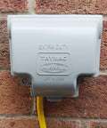 RaynGuard Extra Duty Built Tough Metal Weatherproof In-Use Outlet Cover for Outdoor 1-Gang Gray on brick wall