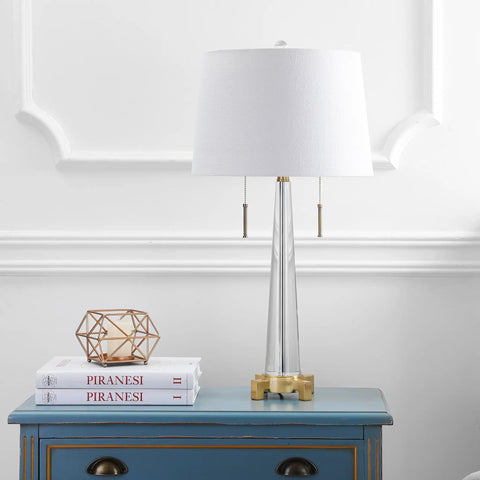 Crystal LED Table Lamp In Clear And Brass Gold Finish, 29.5 Inch Two Light Contemporary Glam Bedside Lamp With White Linen Drum Shade, Pull Chain, Energy Saving Bulbs Included, Perfect Living Room Accent on blue table with decor.