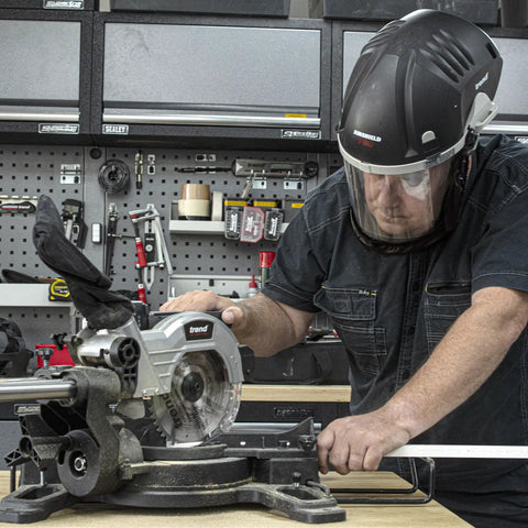 Badass Powered Air Respirator And Hearing Protection Bundle For Woodworking Shops featuring full face shield and dust filters in use.