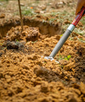 Using Pro-Lite Ergonomic Carbon Steel Digging Fork, Lightweight Garden Tool With Extra-Wide Forward Step For Safety in a garden bed