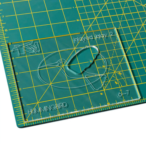 No Sweat 3 Inch Hummingbird Router Inlay Template Cut From Thick Acrylic on cutting mat for woodworking precision.
