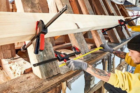 Beefy 12 Inch Trigger Clamp Set With 600 Lb Clamping Force in use for woodworking, Model EHKXL12, securing wood beams