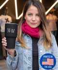 Woman holding Falconry Tumbler With Lid 30 Oz Insulated Stainless Steel Cup Keeps Drinks Hot Or Cold, black color