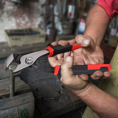 Person using 6.5 Inch Slip Joint Pliers with Groove Joint Function in workshop, demonstrating heavy duty steel construction.