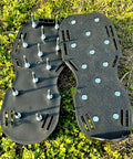 Lawn Aerator Shoes With No Fuss Self Leveling Spikes And Spring System 3 Inch Ground Stakes displayed on grass