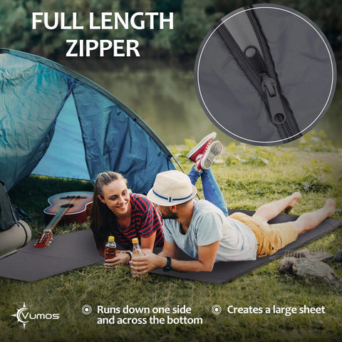 Couple relaxing on Silk Like Sleeping Bag Liner And Camping Sheet With Full Length Zipper For Travel, by a tent at a lake.