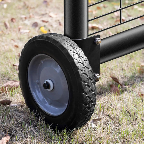 Close-up of an 8 Inch Heavy Duty Gate Wheel on grass, featuring a black rubber tire and gray wheel rim, designed for smooth yard work.