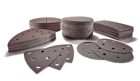 Assorted shapes of Rubin 2 6 Inch P150 Grit Abrasive Sanding Discs, 50 Pack For Woodworking And Paint Prep displayed on a surface