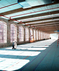 Interior with Aqua Shield Surface Protector 10 Mil 36 Inch By 100 Foot Heavy Duty Protective Film on floor of industrial space.