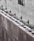 Thermal Grip Kit for Masonry Veneer Anchors Reduces Thermal Bridging Stops Air and Water Infiltration installed on concrete wall.