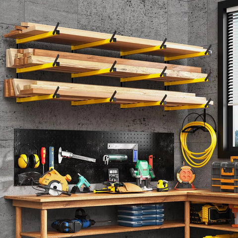 Heavy Duty Folding Lumber Storage Rack 3 Level Wall Mounted Metal Organizer in yellow holds wood above a workshop bench.