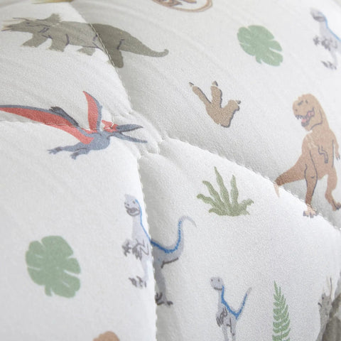 Close-up of Dino Approved Toddler Bed Guard Rail 52 Inch Foam Bed Bumper with Jurassic World dinosaur print design.