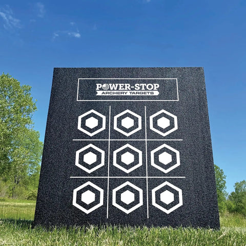 24 Inch Pro Series Big Block Foam Archery Target for Broadheads with hexagonal pattern in a grassy field
