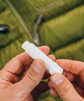 Zipper Lubricant Wax For Tents Drysuits Soft Coolers And More Includes 2 Sticks Non Toxic Silicone Free For Easy Unzipping In All Weather Against Sand Salt Chlorine And Rust, white wax stick in hand