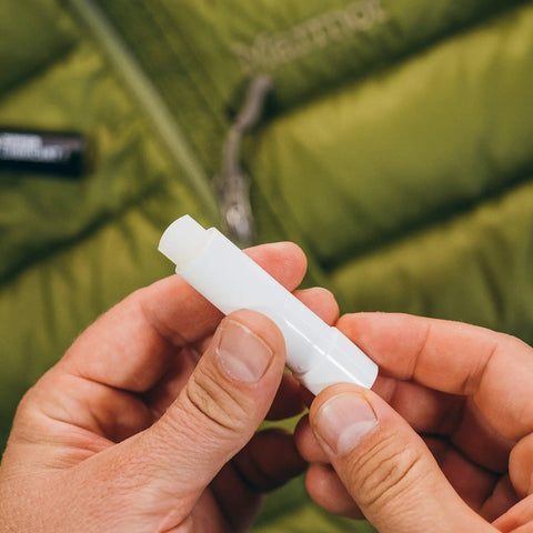 Zipper Lubricant Wax For Tents Drysuits Soft Coolers And More Includes 2 Sticks Non Toxic Silicone Free For Easy Unzipping In All Weather Against Sand Salt Chlorine And Rust, white wax stick in hand