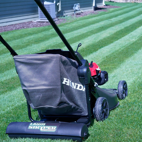 Generation 3 Lawn Striping System Pro Kit attached to Honda mower, creating ballpark-style stripes; works with 20 to 22 inch models