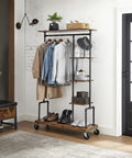 Smooth Rolling 5 Tier Clothes Rack With Industrial Pipe Frame And Rustic Brown Shelves For Organizing Wardrobe Essentials And Flexing Your Daily Fits At Home, showcasing folded clothes and shoes.