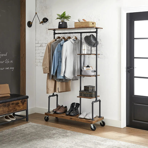 Smooth Rolling 5 Tier Clothes Rack With Industrial Pipe Frame And Rustic Brown Shelves For Organizing Wardrobe Essentials And Flexing Your Daily Fits At Home, showcasing folded clothes and shoes.
