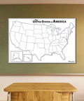 USA Map Dry Erase Laminated Poster 18x24 on classroom chalkboard, showing blank 50 states, durable 3mm lamination.