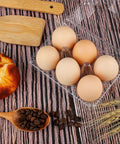 36 Pack Clear Plastic Egg Cartons with Six Egg Capacity Eco Friendly Disposable Egg Holders on wooden surface with bread and beans