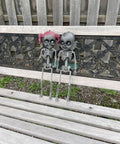 18 Inch Creepy Skeleton Boy Doll With Movable Joints, Durable All Weather Plastic, Realistic Bone Finish on a bench