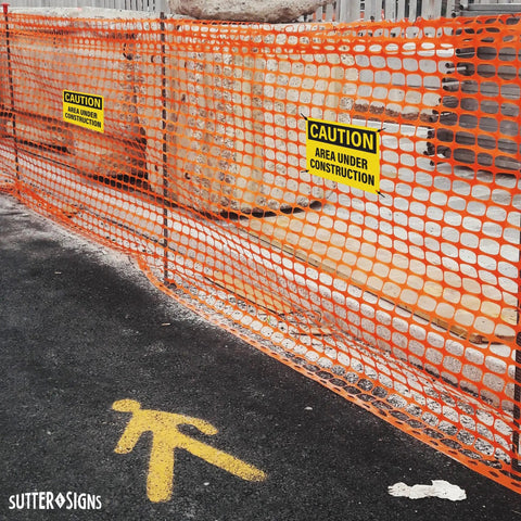 4 Pack Under Construction Signs 10x7 Inches Waterproof PVC Plastic for Worksite Safety on orange construction fence
