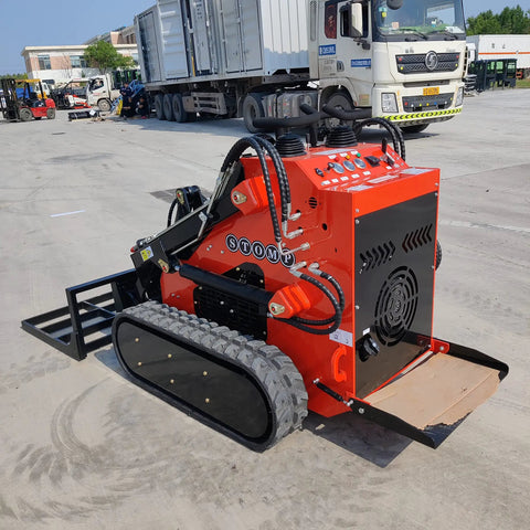 Small But Mighty Mini Skid Steer Loader With Leveler, 1800lbs Capacity, shown in a parking lot with trucks in background.