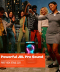 Group of people dancing beside the Stage 320 Portable Party Speaker with telescopic handle and wide wheels, outdoor setting