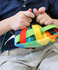 Child playing with Colorful Buckle Pillow Sensory Toy For Fine Motor Development And Kid Friendly Hands On OT Therapy