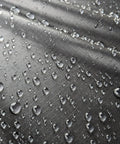 Close-up of water beading on fabric treated with Revivex DWR Spray For Waterproof Jackets And Rain Gear Keeps Your Gear Dry And Gore-Tex Breathable With Water Beading Again Restore Waterproofing For Tents Camping Gear And Winter Wear For Real World Adventures