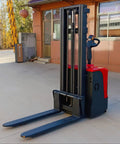 Heavy Duty Electric Fork Stacker Pallet Stack Truck Built With Smooth Hydraulic Handles and a strong frame in warehouse setting.