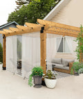 All Weather Outdoor Sheer Curtains 6 Pack For Patio And Porch, Rod Pocket Beige 54x84 Inches, installed on pergola.