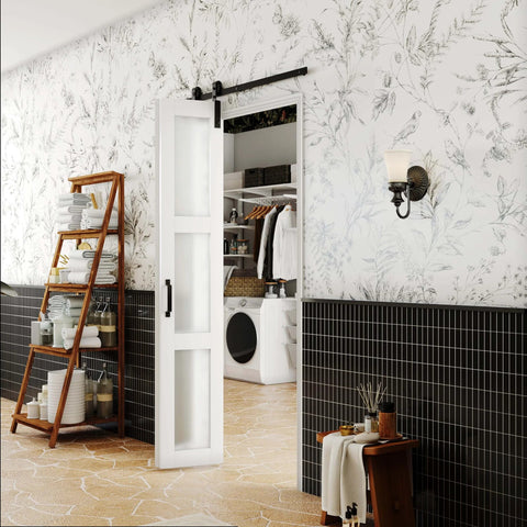 3 Lite Glass Bi Fold Barn Doors, 30 By 84 Inch Slab With 2.83 Ft Sliding Hardware Kit, installed in a laundry room with decorative wallpaper.